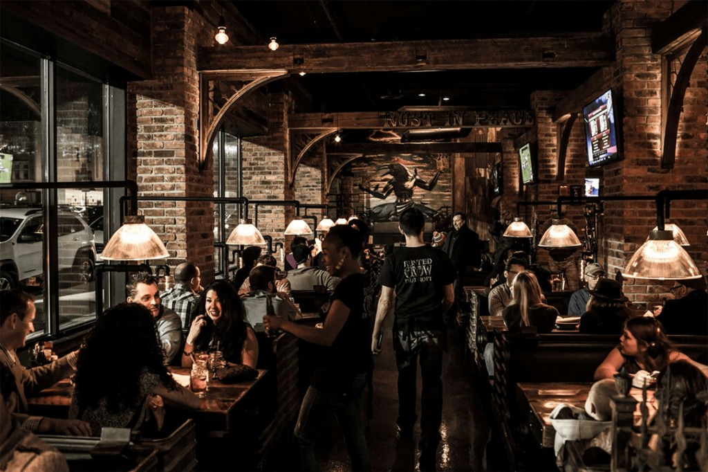 Busy restaurant dining room with warm lighting